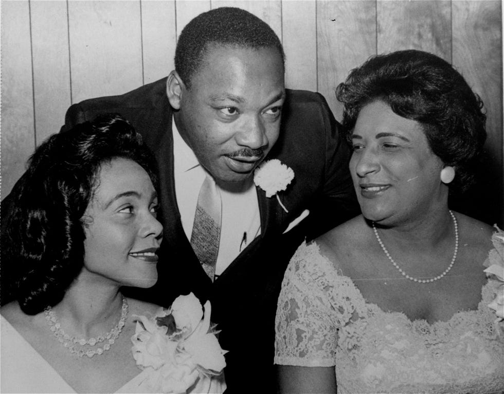 In this Aug. 9, 1965, file photo, Dr. Martin Luther King, Jr., president of the Southern Christian Leadership Conference, chats with his wife, Coretta, left, and civil rights champion Constance Baker Motley before the start of an S.C.L.C. banquet in Birmingham, Ala.