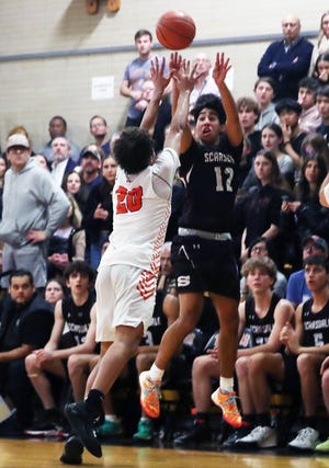 Scarsdale's Carlos Rodriguez (12) in action against Mamaroneck at Mamaroneck High School Jan. 13, 2023.