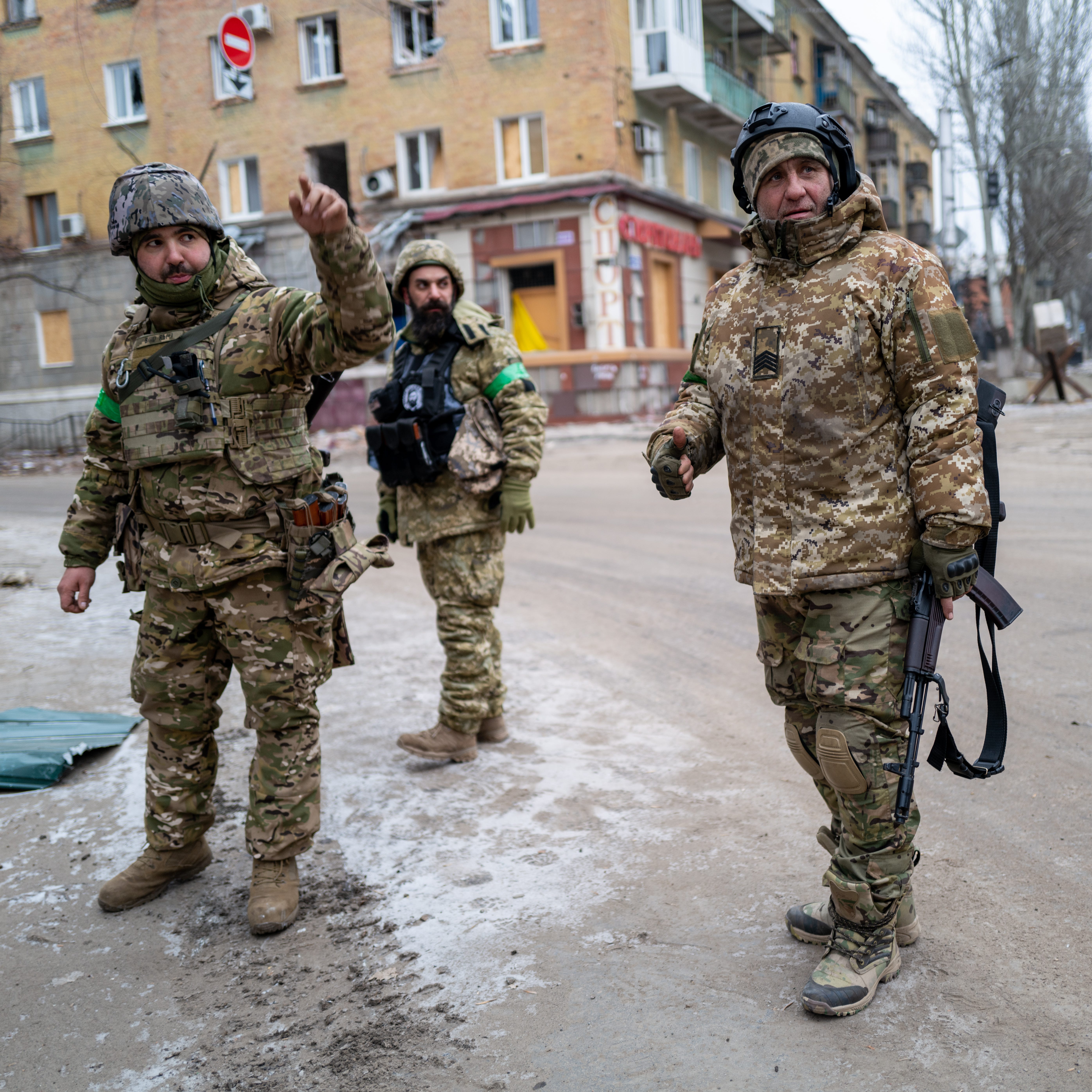 Ukrainian soldiers walk through the heavily damaged city of Bakhmut, which has become one of the most intense battles in the nearly year long war with Russia on Friday, Jan. 13, 2023. Russia has stepped up its offensive in the Donetsk region in the new year, with the region's Kyiv-appointed governor accusing Russia of using scorched-earth tactics.