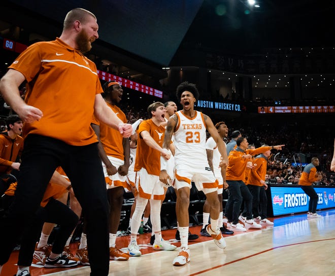 The Texas bench, including Texas forward Dillon Mitchell, No. 23, celebrate during a win over Texas Tech in January. Wins over Baylor and Kansas State last week propelled the Longhorns to No. 5 in the latest Associated Press poll.