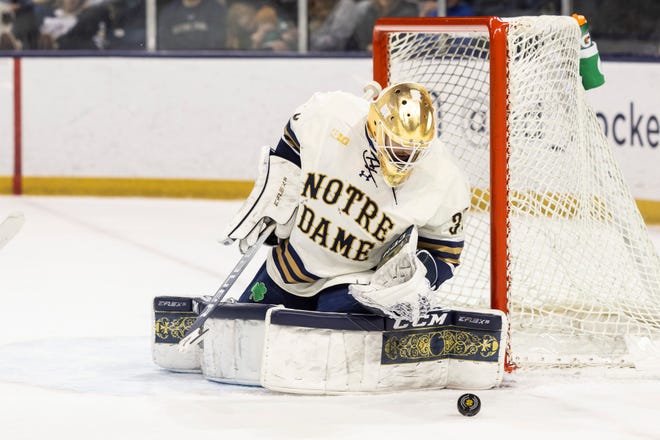 Notre Dame’s Ryan Bischel (30) makes the save during the Minnesota-Notre Dame NCAA hockey game on Saturday, January 14, 2023, at Compton Family Ice Arena in South Bend, Indiana.