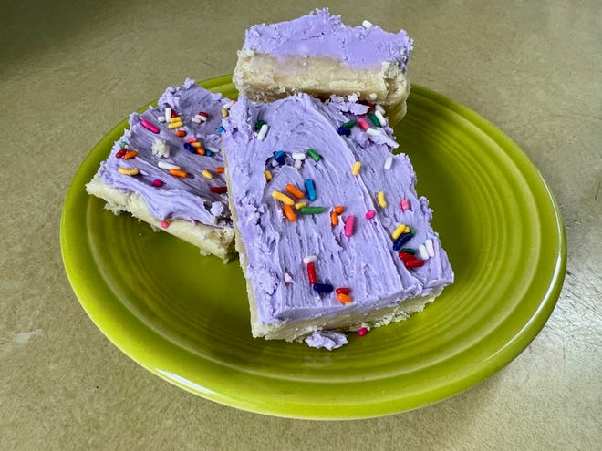 Sprinkles, buttercream and a barely-baked cookie base make these sugar cookie bars a great treat to celebrate but are easy enough to make on a weekday.