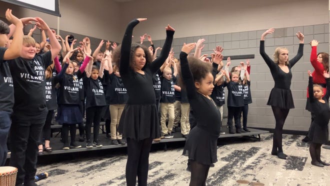 Par Excellence Academy students singing at the Martin Luther King Jr. Day breakfast Monday at the Reese Center on the Newark campus of Ohio State University and Central Ohio Technical College.