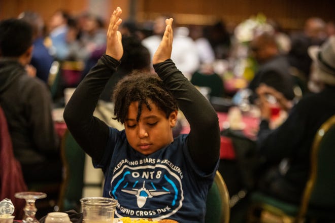 Edward Turner-Estrada, 10, of Perris listens and applauds during the speeches at the Southern California Black Chamber of Commerce's Palm Springs Area Chapter Rev. Dr. Martin L. King Jr. Prayer Breakfast at Miracle Springs Resort and Spa in Desert Hot Springs, Calif., on Monday, Jan. 16, 2023.