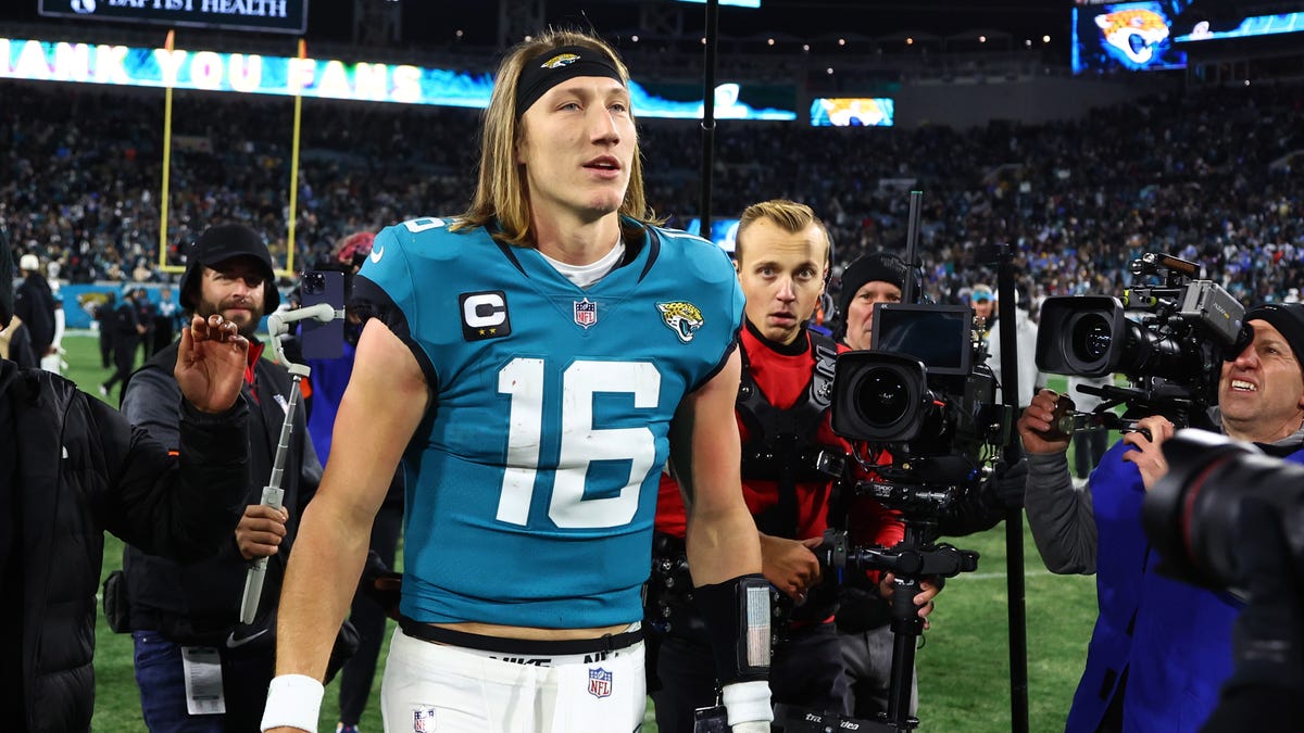 Jacksonville Jaguars quarterback Trevor Lawrence celebrates after defeating the Los Angeles Chargers 31-30 during a wild-card game at TIAA Bank Field.