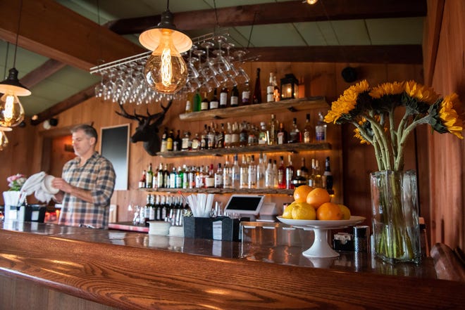 Larry Melo, the new owner of The Cub Room in New Hope, works behind the bar on Wednesday, January 11, 2022, three days after its reopening.