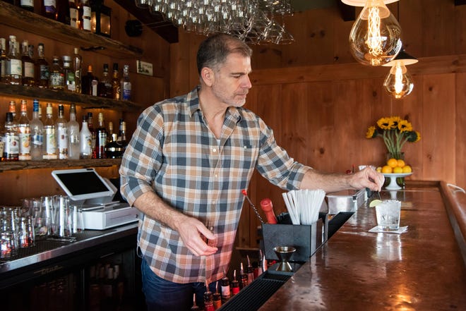 Larry Melo, the new owner of The Cub Room in New Hope, works behind the bar on Wednesday, January 11, 2022, three days after its reopening.