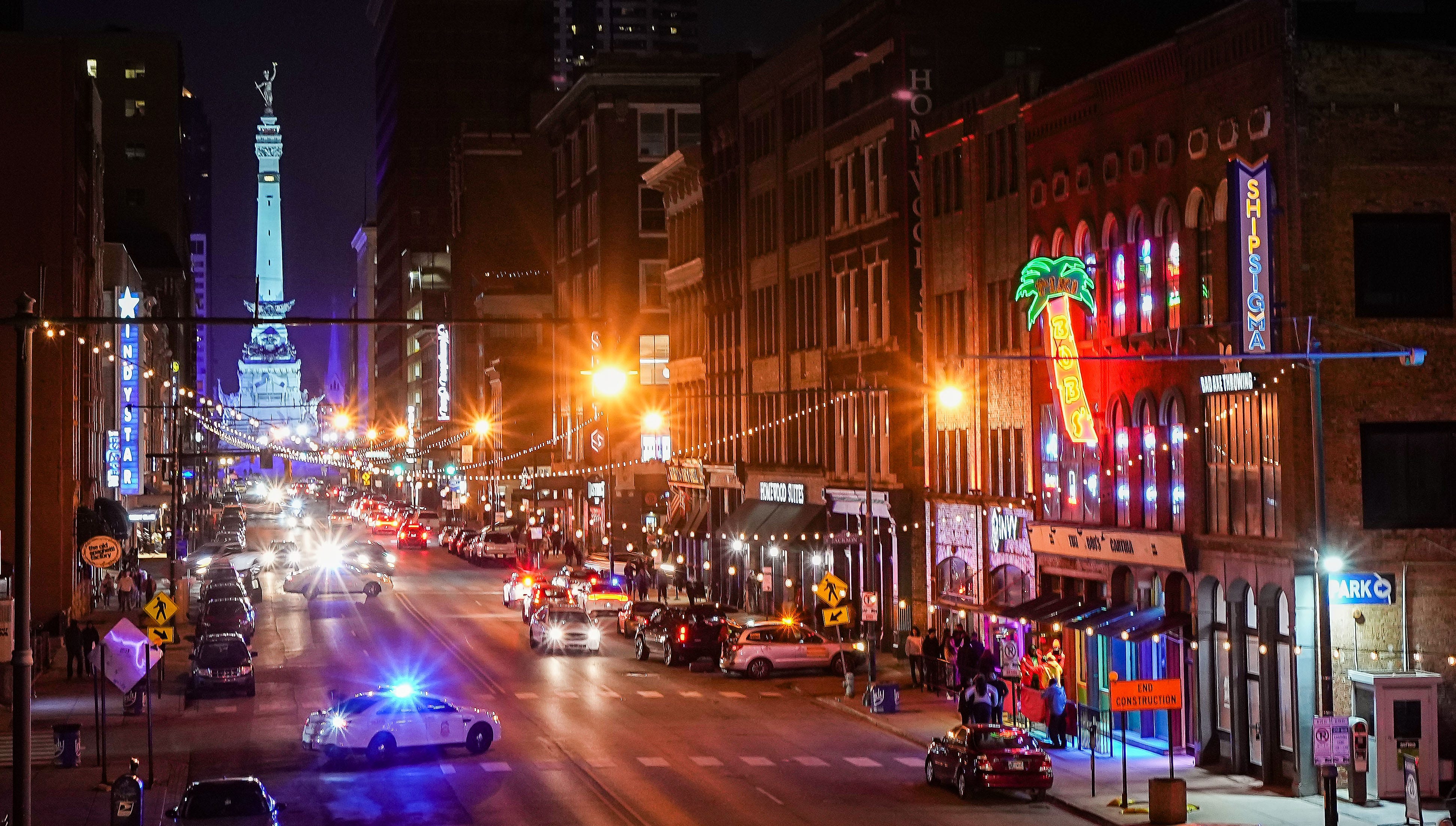 Officers sit outside of the busy bar district on South Meridian Street on a Saturday night in January. IMPD spent nearly $2.9 million on overtime from 2019 to 2022 just for extra patrols in a two-block area that is home to several bars and clubs.