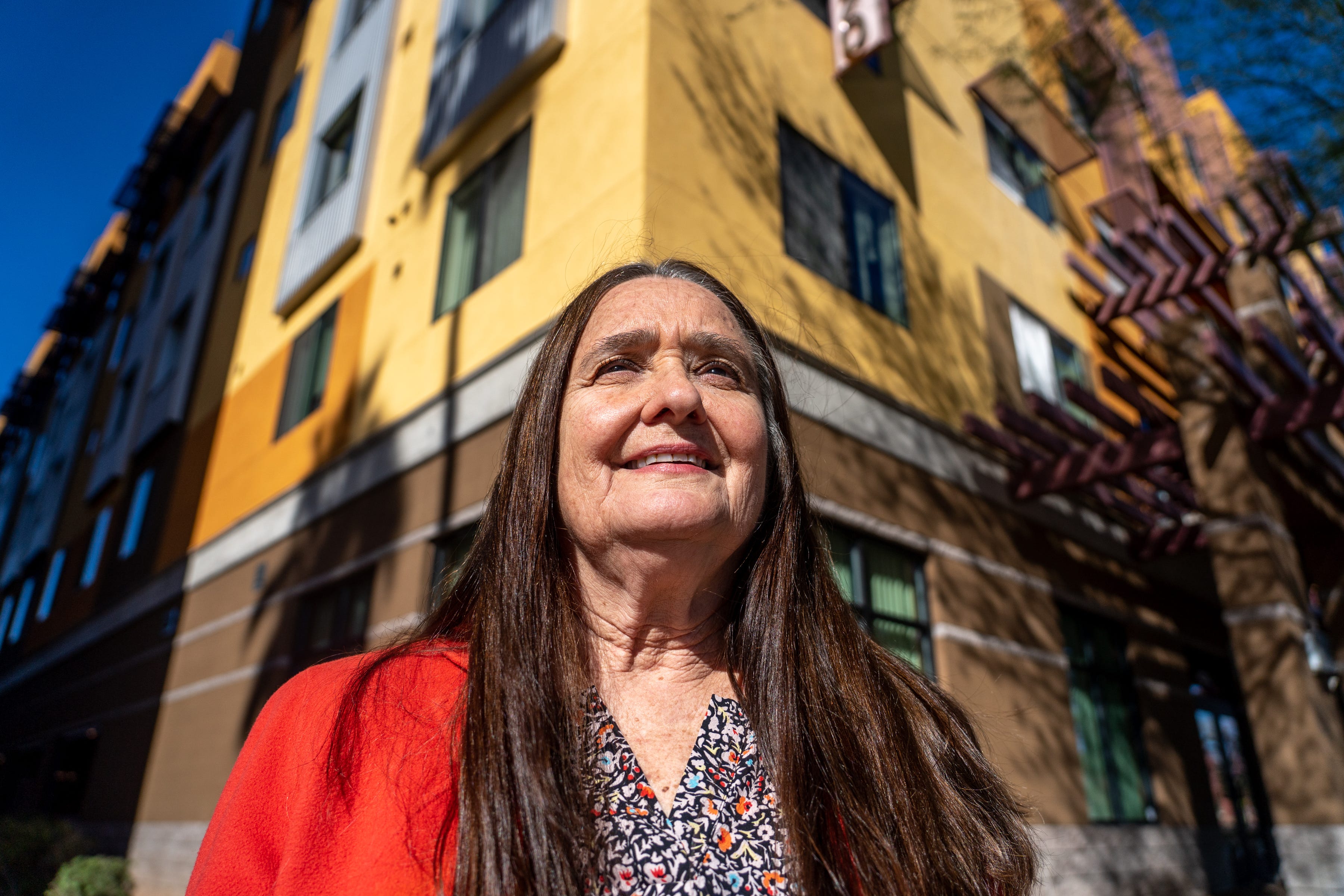 Diana Yazzie Devine, CEO of Native American Connections, poses for a portrait outside the Devine Legacy apartments in Phoenix on Jan. 17, 2023.