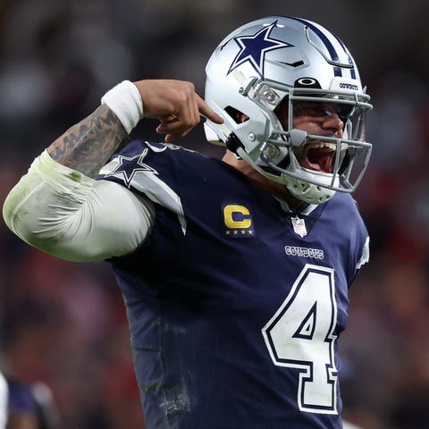 Dak Prescott celebrates after throwing a touchdown