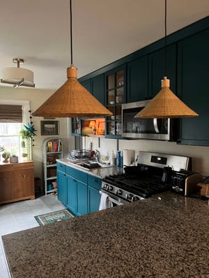 New pendant light fixtures dangle from the ceiling over Tess Bennett's kitchen counter. The new fixtures did present a few challenges.