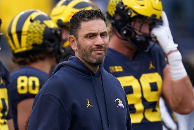 After previously being suspended with pay, Michigan co-offensive coordinator Matt Weiss was fired Friday.