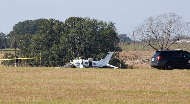 Wreckage from a small plane appears on a field off of County Road 462 on Tuesday, Jan. 17, 2023, outside Yoakum, Texas. (Chase Cofield/The Victoria Advocate via AP)