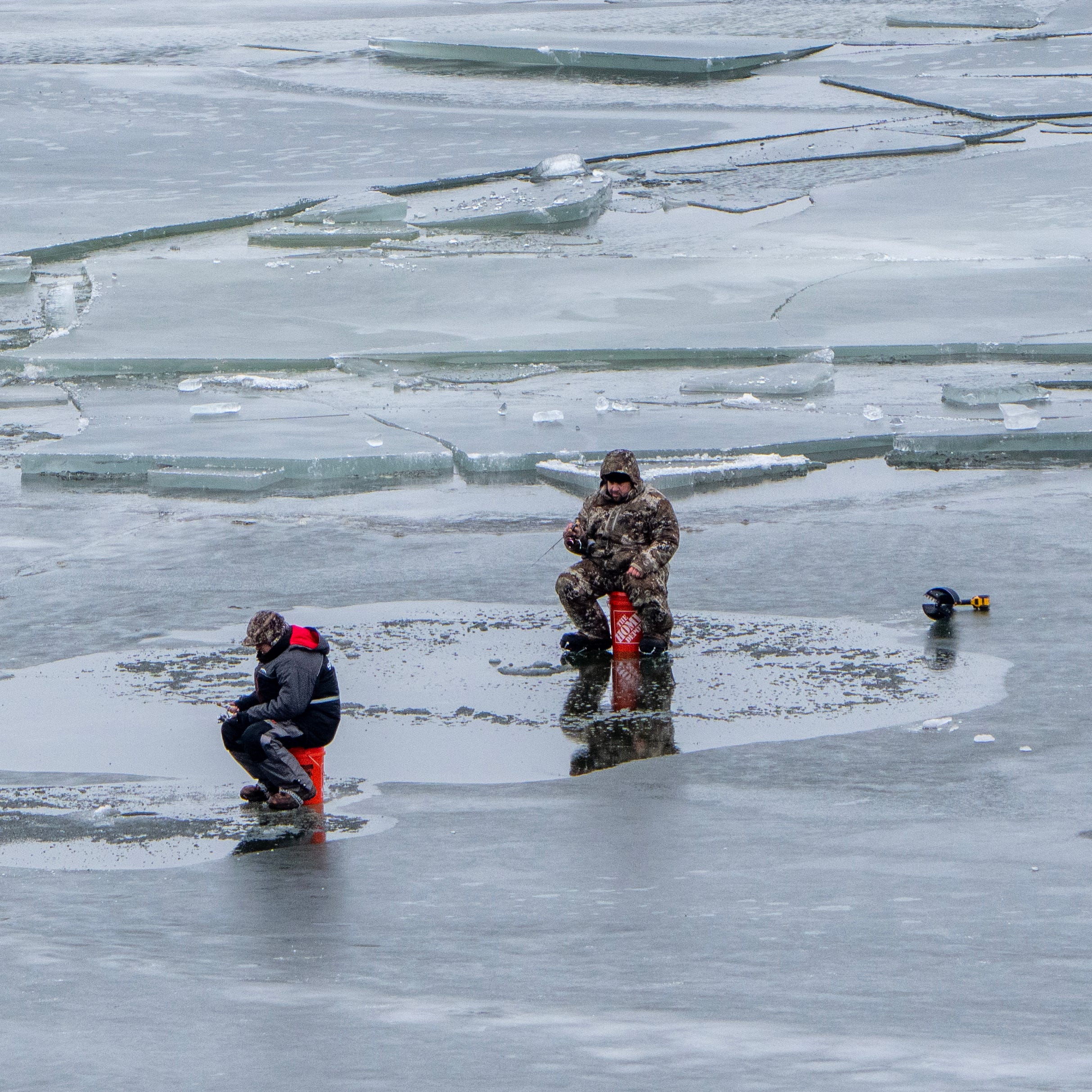 Ice fishermen stay close to shore Wednesday, January 18, 2023 on Green Bay off of Bay Shore Park in New Franken, Wis. Ice has been slow to form this year with only 3 percent of the lakes covered as of Jan. 13. The near-record low is roughly 18 percent below average for this time of year. Lake whitefish, a mainstay in the lakes' fishing industry and an important food source for other fish like walleye, are one of the many Great Lakes fish that will be impacted by less ice cover.Lake whitefish spawn in the fall in   nearshore areas, leaving the eggs to incubate over the winter months. Without ice, strong winds and waves can stir up the sediment, reducing the number of fish that are hatched in the spring.