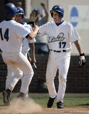 FGCU teammates Casey Coleman (17) and Patrick Garrido (14) celebrate after scoring in the sixth inning against Lynn University during a game at the University of Tampa on Thursday, May 18, 2006.