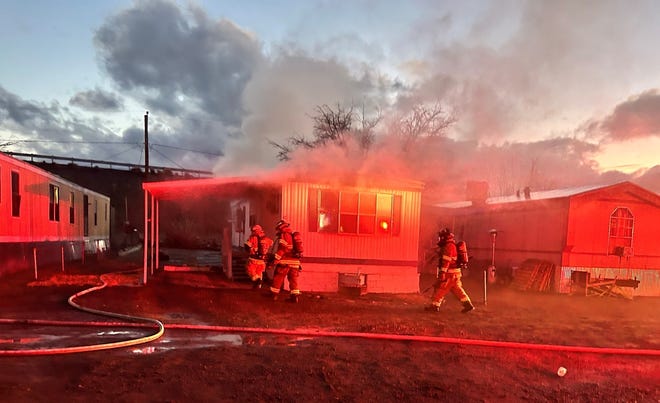 Las Cruces firefighters extinguished a blaze on Tuesday in this mobile home on south Valley Drive.