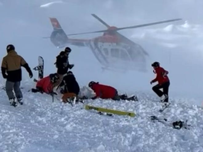 Skiers, including VMI cadet Erik Gottman, scramble to rescue the avalanche victims in Zürs, Austria on Christmas Day.