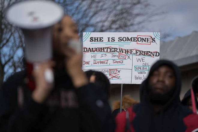 Students hold up signs against sexual assault at a protest at Delaware State University on Wednesday, Jan. 18, 2023.