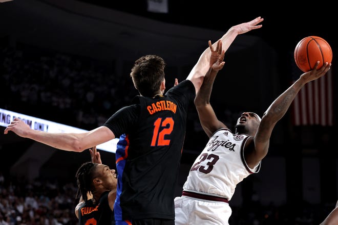 Jan 18, 2023; College Station, Texas, USA; Texas A&M Aggies guard Tyrece Radford (23) shoots the ball while Florida Gators forward Colin Castleton (12) defends during the second half at Reed Arena. Mandatory Credit: Erik Williams-USA TODAY Sports
