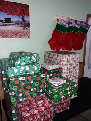 Family Christmas gifts and stockings waiting to be opened.