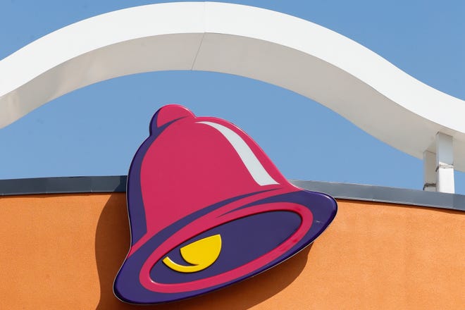 This July 30, 2019 file photo shows a sign outside a Taco Bell restaurant in Conyers, Georgia.