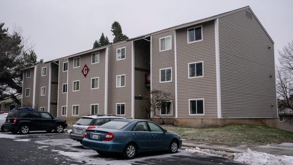 An apartment building that housed the suspect in a