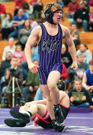 Bloomington South’s Brant Turner celebrates after winning his 138-pound match against Edgewood’s Joel Silvernail during the Bloomington South-Edgewood wrestling match at South on Thursday, Jan. 19, 2022.