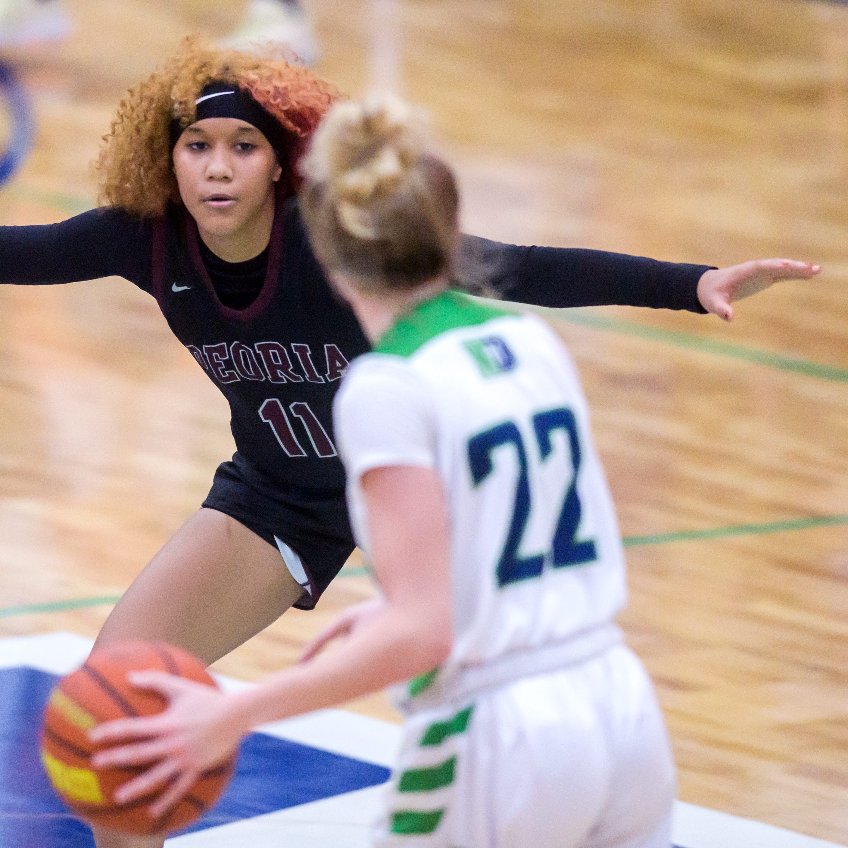 Peoria High's Aaliyah Guyton (11) guards Peoria Notre Dame's Mya Wardle in the second half Thursday, Jan. 19, 2023 at PND High School. The Lions defeated the Irish 47-37.