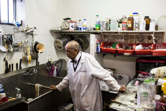 Dr. Charles Champion stands in the compounding room within his pharmacy on Elvis Presley Boulevard on Dec. 23, 2015. Champion started pharmacy school in 1951 before having a store in Memphis in 1981.