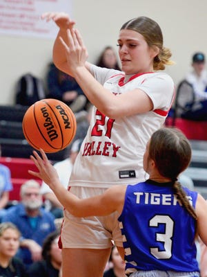 Caney Valley's Chloe Scherman, left, reacts to the ball during girls varsity basketball play on Jan. 20, 2023, in the Caney Valley Invitational.