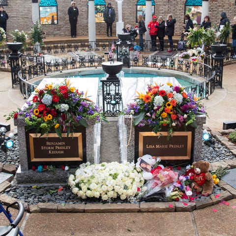 Mourners move in a procession through the Meditati