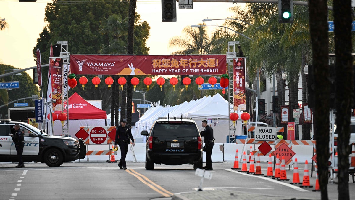 Police stand near the scene of a mass shooting in Monterey Park, California, on January 22, 2023.