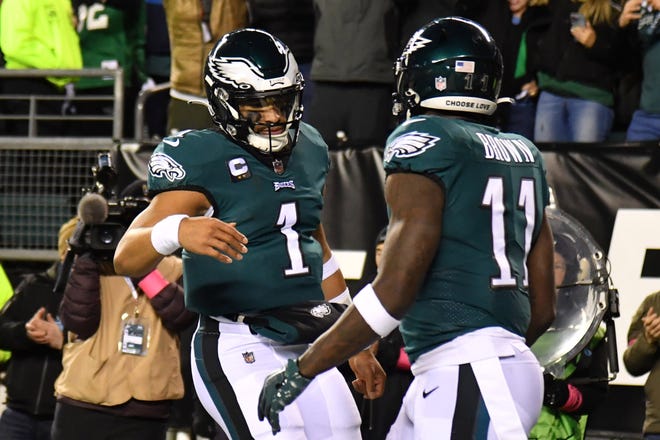 Philadelphia Eagles quarterback Jalen Hurts (1) celebrates his touchdown with wide receiver A.J. Brown (11) during the second quarter against the New York Giants during an NFC divisional round game at Lincoln Financial Field.