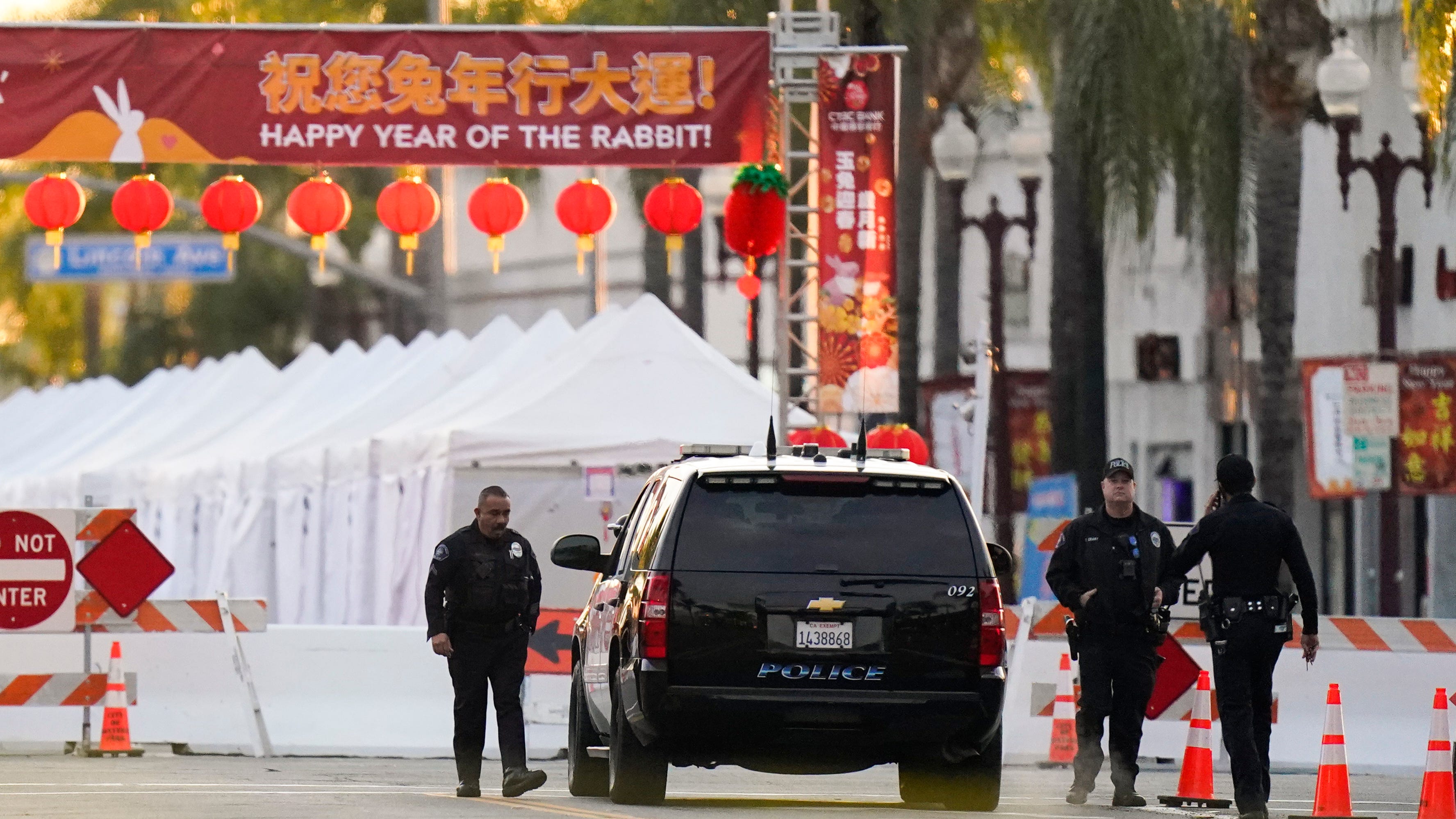 Police officers stand outside a ballroom dance club in Monterey Park, Calif., on, Jan. 22, 2023, where a mass shooting occurred.