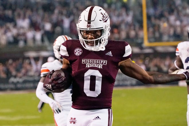 Mississippi State wide receiver Rara Thomas (0) smiles as he scores a 33-yard touchdown pass reception against Auburn during the second half of an NCAA college football game in Starkville, Miss., Saturday, Nov. 5, 2022. Mississippi State won 39-33 in overtime. (AP Photo/Rogelio V. Solis)