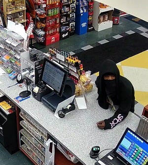 Canton police are seeking information about this masked man who robbed two convenience stores last week. The man had a gun and demanded money from the cash register.