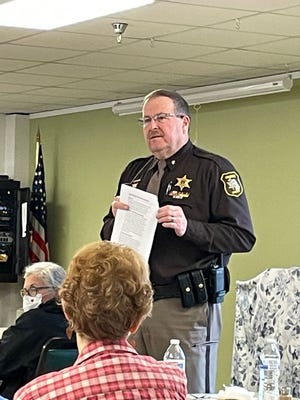 Monroe County Sheriff Troy Goodnough speaks last week at the Monroe Center for Healthy Aging about scams and how to avoid them.