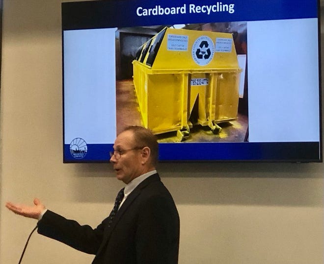 An image showing one of the "clean cardboard only" public recycling bins Shawnee County plans to put out could be seen in the background Monday as Bill Sutton, director of the county's solid waste department, spoke to county commissioners.