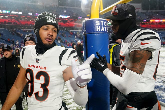 Cincinnati Bengals wide receiver Tyler Boyd (83) and Cincinnati Bengals offensive tackle Isaiah Prince (75) walk off the field at the conclusion of an NFL divisional playoff football game between the Cincinnati Bengals and the Buffalo Bills, Sunday, Jan. 22, 2023, at Highmark Stadium in Orchard Park, N.Y. 