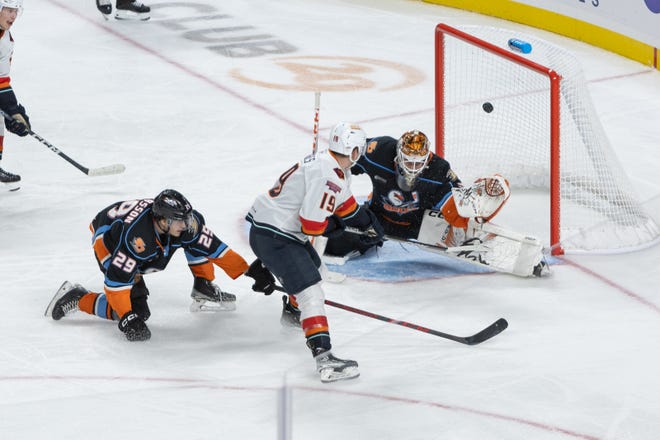 Coachella Valley Firebirds' left winger Cameron Hughes scores the final goal of the game in a 4-2 win over the San Diego Gulls on Sunday, Jan. 22, 2023 at Acrisure Arena.