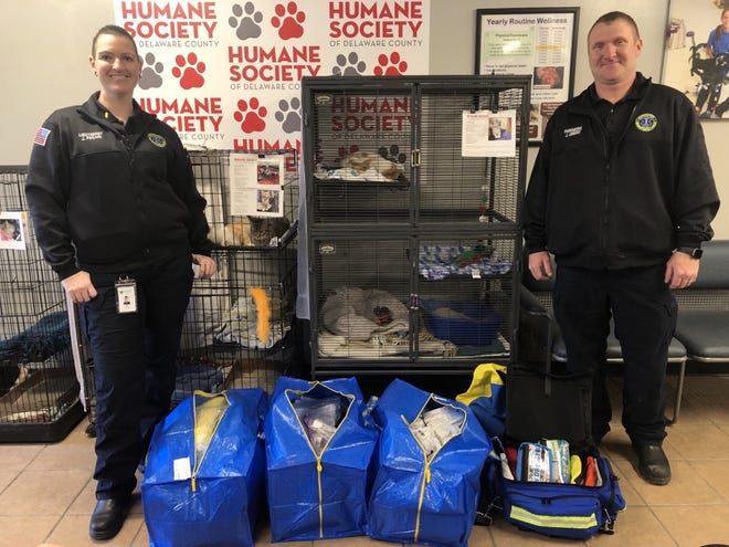 Lt. Jess Paqari, left, and logistics coordinator Justin Lowery, both of Delaware County Emergency Medical Services, deliver some of the medical supplies that were either expired or not needed to the Humane Society of Delaware County in December.