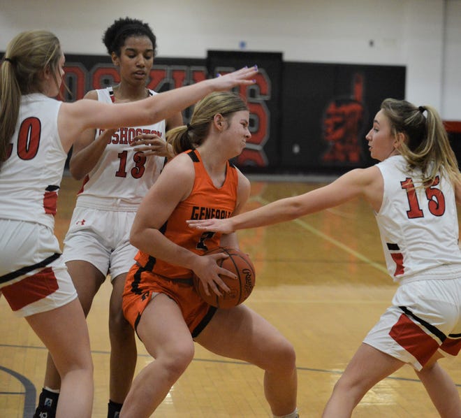 Ridgewood's Kya Masloski (orange) fights through three Coshocton defenders, Hailey Helter (20), Savannah Bartlett (13) and Isabelle Lauvray 13) during Monday's game. Both teams found out their tournament draws on Sunday.