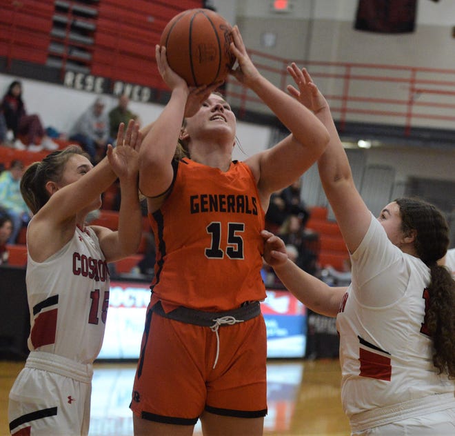 Ridgewood's Kelley Masloski goes up for a shot against Coshocton's Isabelle Lauvray (left) and Myrakle Johnson (right) in Monday's game. The Generals won 42-37.