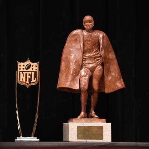 Walter Payton NFL Man of the Year trophy and the N