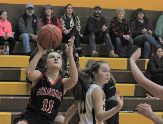 Onaway sophomore Kailyn George (11) gets ready to put up a shot during the second half of Tuesday night's girls basketball contest at Pellston. George's 16 points led the Lady Cardinals, who cruised to victory over the Lady Hornets.