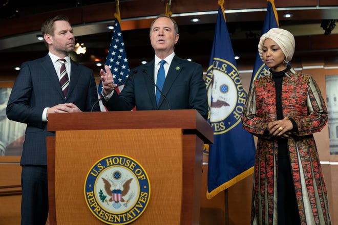 Rep. Adam Schiff, D-Calif., center, with Rep. Eric Swalwell, D-Calif., left, and Rep. Ilhan Omar, D-Minn., speaks during a news conference on Capitol Hill in Washington on Wednesday.