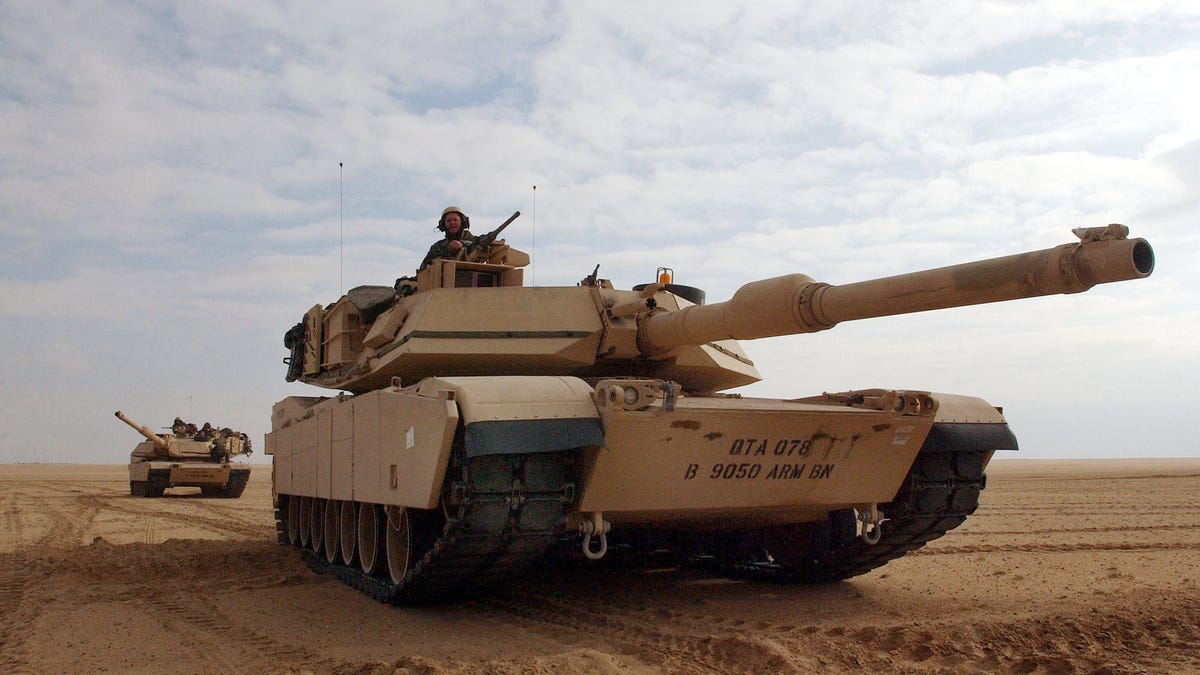 U.S. Army M1/A1 Abrams tanks from Charlie company of the 464 Armored Battalion are deployed during task force manuevers December 18, 2002 near the Iraqi border in the Kuwaiti. The U.S. military continues to train throughout the gulf region in case of possible deployment to Iraq.