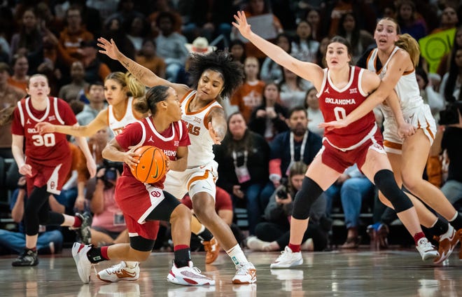 Texas Longhorns guard Rori Harmon (3) defends Oklahoma Sooners guard Nevaeh Tot (1) as she looks for a pass during the second half of the Longhorns' game against the Sooners at the Moody Center in Austin, January 25, 2023.  The Longhorns won the game 78-58. 