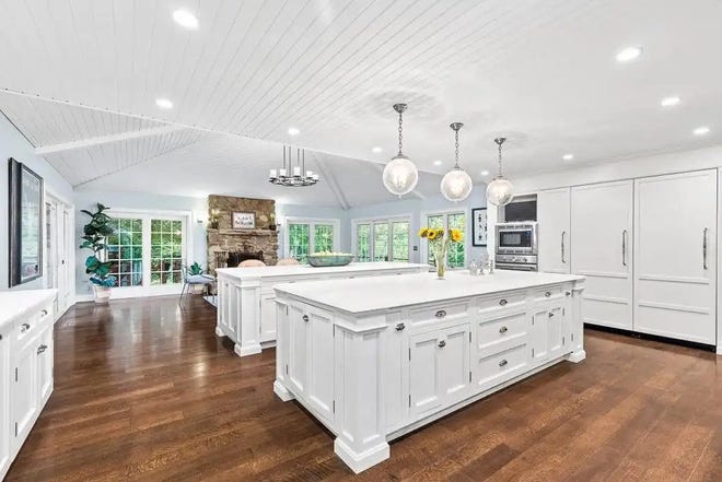 The kitchen in the house at 700 Dutch Road in Fairview Township features two large islands, two refrigerators and a backsplash made from hand-carved seashells.