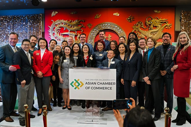 The Greater Oklahoma City Asian Chamber of Commerce Board of Directors stand with Gov. Kevin Stitt, Oklahoma City Mayor David Holt and others at the official kickoff event at Grand House China Bistro in Oklahoma City.